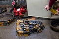 Washing of parts from a car or tractor yellow from black oil before repair and restoration. Vehicle gearbox service