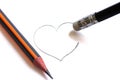 Washing on a pencil erases the painted heart. Simple pencils symbolize ruined love