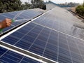 Washing of Photovoltaic solar panels for better absorption of sunlight as a source of energy to generate direct current Royalty Free Stock Photo