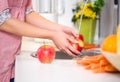 Washing red apple under the tap Royalty Free Stock Photo