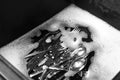 Washing silver spoons, forks and knives in kitchen sink with foam, above view Royalty Free Stock Photo