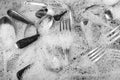 Washing silverware in the sink with soap suds