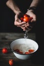 Washing tomatoes. Male chef washing tomatoes. Tomatoes in hands Royalty Free Stock Photo