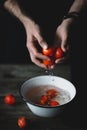 Washing tomatoes. Male chef washing tomatoes. Tomatoes in hands Royalty Free Stock Photo