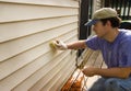 Washing Vinyl Siding of House