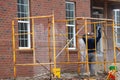 washing the walls of a brick house water job nozzle workeer Royalty Free Stock Photo