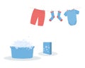 Washing: washed baby clothes cute Capri pants,socks and bodysuit hanging on clothesline and they are attached by clothespins.Blue