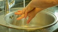 washing well between the fingers with soap to eliminate possible microbes