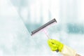 Washing windows theme. Window cleaner using a squeegee to wash a windows. Spring cleaning concept. Window cleaning brush for Royalty Free Stock Photo