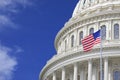 Washington DC Capitol dome detail with waving American flag Royalty Free Stock Photo