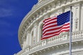 Washington DC Capitol dome detail with waving American flag Royalty Free Stock Photo