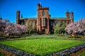 Washington DC - Flowering magnolia blossom trees and gardens frame the Smithsonian Castle on the National Mall in Royalty Free Stock Photo