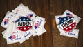 Washington DC--July 5, 2020; Joe Biden and Donald Trump campaign buttons sitting on piles of I Voted stickers with Biden having a