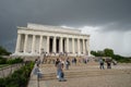 Washington DC - May 9, 2019: Crowds of tourists visit the Lincoln Memorial monument, as a severe thunderstorm rolls in