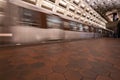 Washington DC - May 9, 2019: A Washington DC Metro train speeds by in an underground station in Federal Triangle