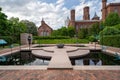 Washington, DC - May 9, 2019: The Moongate Garden with dragonfly statues in the Enid Haupt Garden and the Smithsonian Castle on