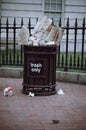 Washington DC: Overflowing trash can on the sidewalk of downtown DC. Concept for garbage, clean up, enviornment,