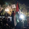Washington, DC - 11-4-2023: Protestor wearing a Palestine Flag Royalty Free Stock Photo