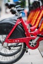 Washington DC, USA - June 9, 2019: Row of Red Bicycles Used in the Capital Bikeshare Program Resting on the side walk - image