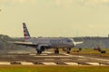 An Airbus A321 passenger airplane operated by American Airlines is maneuvering on the runway