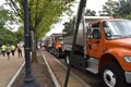 A row of DC municipal trucks serving as a security barrier with police cars along Third Street near the Justice for J6 Protest Royalty Free Stock Photo