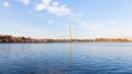 Washington Monument across Tidal Basin during cherry blossom festival. Royalty Free Stock Photo