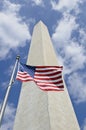 Washington Monument with American flag in front Royalty Free Stock Photo