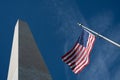 Washington Monument and United States of America Flag with Blue Sky Background Royalty Free Stock Photo