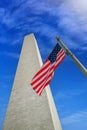 Washington monument with the USA flag on a sunny day. Royalty Free Stock Photo