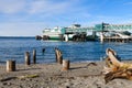 Washington State Ferry Kaleetan at Edmonds dock and next to beach with driftwood