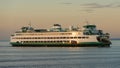 Washington State Ferry Spokane crossing Puget Sound as the evening sun sets