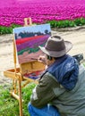 Washington, USA - April 16, 2010: Male artist on painting on canvas in outdoor. Plein-air.