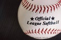 Washington USA 1 May 2022 Official league softball. A white and red vintage leather ball top view on dark background Royalty Free Stock Photo