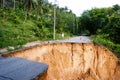 Washout: rain flood damaged badly washed out road in Thailand Royalty Free Stock Photo