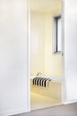 Washroom entrance and a bathtub with a towel Royalty Free Stock Photo