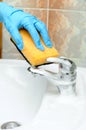 Washstand faucet cleaning Royalty Free Stock Photo