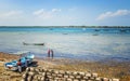 Wasini island, Kenya, AFRICA - February 26, 2020: Men and ships and small boats on the water on wild island. It is the