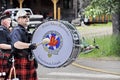 The Prince Albert Highlanders Band and an RCMP and Parks Canada Color Guard march in a parade at Waskesiu to celebrate Canada Day