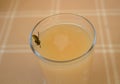 A wasp on a glass with juice