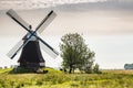 Wasserschoepfmuehle Wynhamster Kolk. East Frisian landscape with mill near the town of Leer, East Frisia, Lower Saxony, Germany Royalty Free Stock Photo