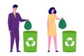 Wast concept. Woman and man trowing trash into green recycle selective bin. Royalty Free Stock Photo