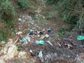 Waste abandoned in nature, a symbol of pollution and incivility Royalty Free Stock Photo