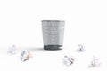 A waste basket with crumpled papers outside Royalty Free Stock Photo