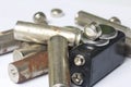 Waste batteries of different types are scattered. On a white background. Royalty Free Stock Photo