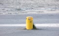 Waste bin on a sandy beach Royalty Free Stock Photo