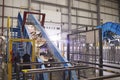 Waste cardboard entering recycling plant on a conveyor belt