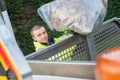 waste collector with broom and garbage bin Royalty Free Stock Photo