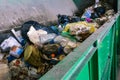 Waste container on the sorting line of a recycling plant. The process of separating garbage in a container. Packages