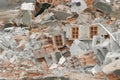 waste from deconstruction demolition: a pile of rubble made of bricks and cement concrete blocks