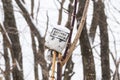 Waste, garbage, trash, under the snow in the forest. Littered nature Royalty Free Stock Photo